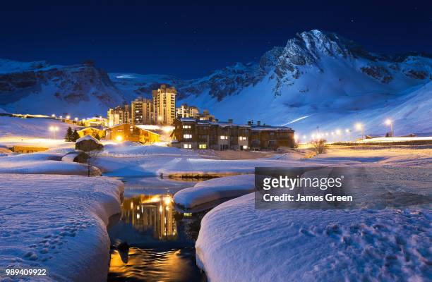 val claret illuminated at night in winter, tignes, france. - tignes stock pictures, royalty-free photos & images