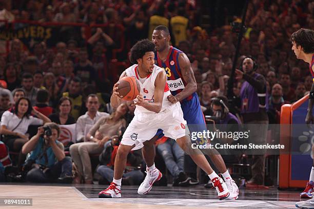 Josh Childress, #6 of Olympiacos Piraeus competes with Pete Mickeal, #33 of Regal FC Barcelona during the Euroleague Basketball Final Four Final Game...