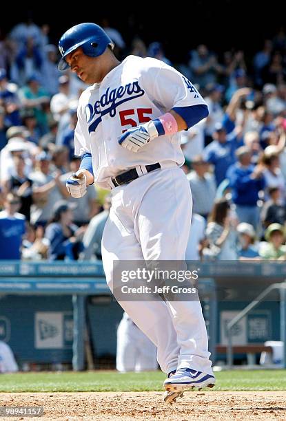 Russell Martin of the Los Angeles Dodgers crosses home plate after hitting a solo homerun in the eighth inning against the Colorado Rockies at Dodger...