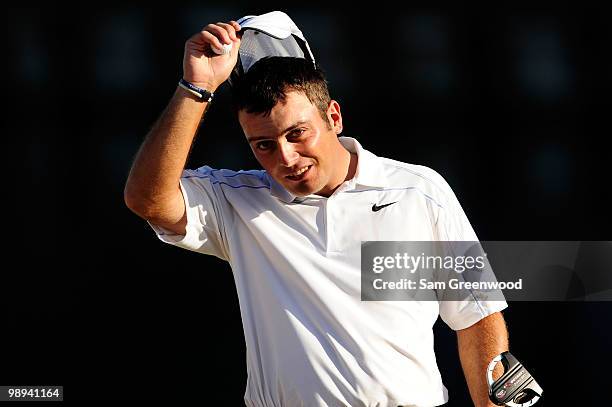 Francesco Molinari of Italy waves his cap on the 18th hole during the final round of THE PLAYERS Championship held at THE PLAYERS Stadium course at...