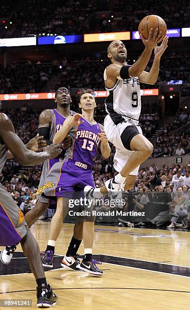 Guard Tony Parker of the San Antonio Spurs takes a shot against Steve Nash of the Phoenix Suns in Game Four of the Western Conference Semifinals...