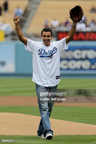 Jonathan Bornstein of MLS soccer team Chivas USA reacts after throwing out the first pitch prior to the start of the game between the Los Angeles...