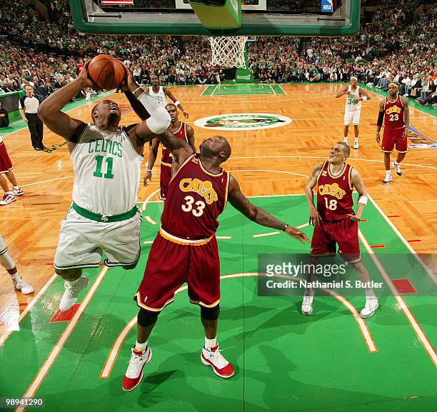 Glen Davis of the Boston Celtics shoots against Shaquille O'Neal of the Cleveland Cavaliers in Game Four of the Eastern Conference Semifinals during...