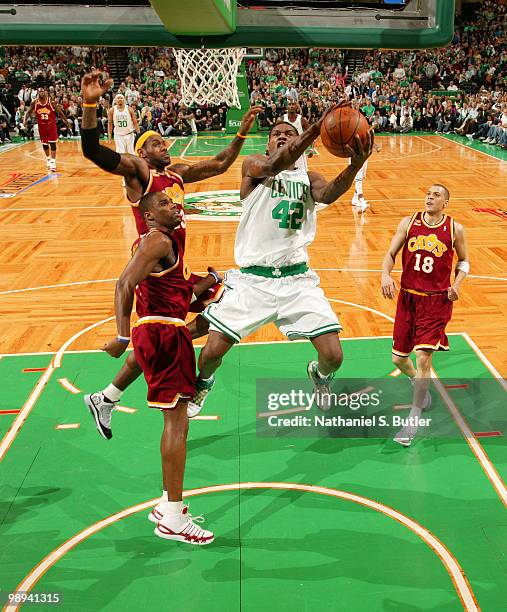 Tony Allen of the Boston Celtics shoots against Antawn Jamison and LeBron James of the Cleveland Cavaliers in Game Four of the Eastern Conference...