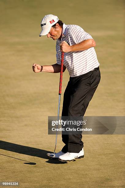 Tim Clark of South Africa reacts after saving par at the 18th hole during the final round of THE PLAYERS Championship on THE PLAYERS Stadium Course...