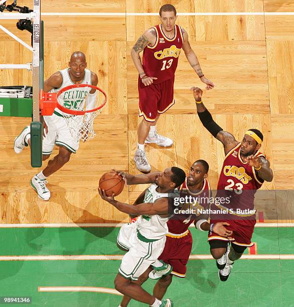 Tony Allen of the Boston Celtics shoots against Antawn Jamison and LeBron James of the Cleveland Cavaliers in Game Four of the Eastern Conference...