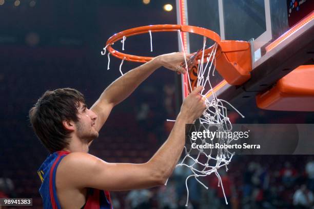 Ricky Rubio of Barcelona celebrate cutting the net of the basket during the Euroleague Basketball Final Four Final Game between Regal FC Barcelona vs...