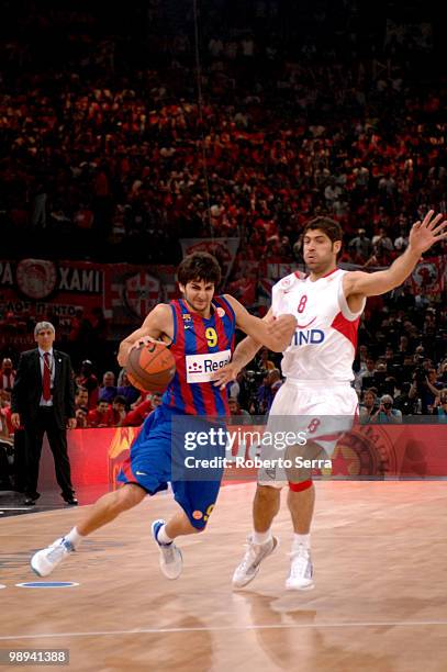 Ricky Rubio of Barcelona and Panagiotis Vasilopoulos of Olympiacos in action during the Euroleague Basketball Final Four Final Game between Regal FC...