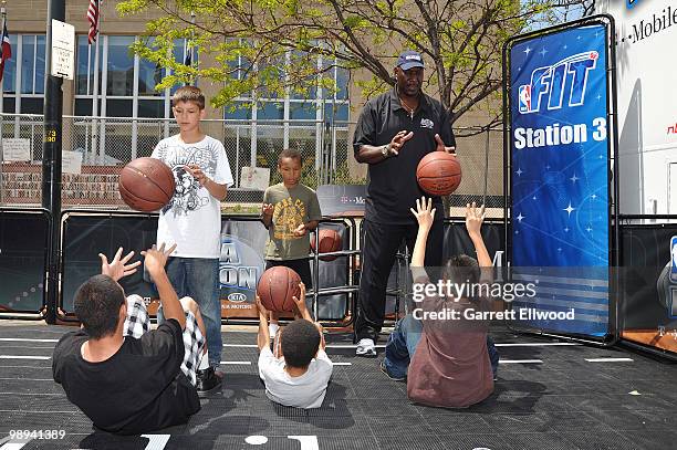 Legend Darryl Dawkins runs kids through an NBA Fit program during the NBA Nation Mobile Basketball Tour on May 9, 2010 at the "Cinco De Mayo...