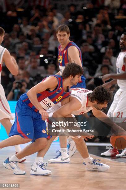 Ricky Rubio of Barcelona and Milos Tedosic of Olympiacos in action during the Euroleague Basketball Final Four Final Game between Regal FC Barcelona...