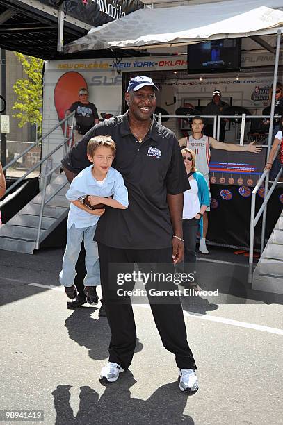 Legend Darryl Dawkins poses for a photo with with a child during the NBA Nation Mobile Basketball Tour on May 9, 2010 at the "Cinco De Mayo Festival"...