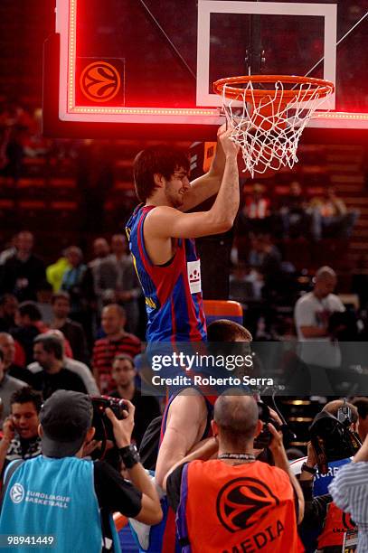 Ricky Rubio and Fran Vazquez of Barcelona celebrate cutting the net of the basket during the Euroleague Basketball Final Four Final Game between...