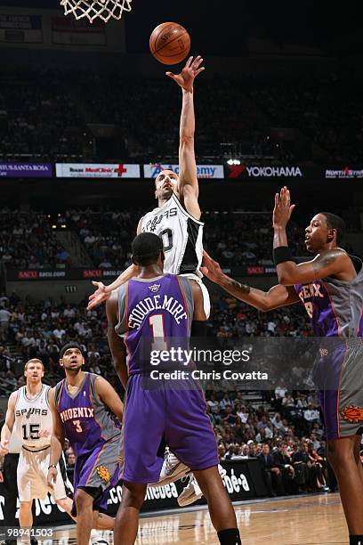 Manu Ginobili of the San Antonio Spurs shoots over Amar'e Stoudemire of the Phoenix Suns in Game Four of the Western Conference Semifinals during the...