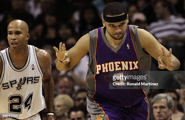 Forward Jared Dudley of the Phoenix Suns reacts after making a three-point shot in front of Richard Jefferson of the San Antonio Spurs in Game Four...