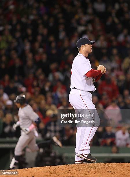 Alex Rodriguez of the New York Yankees rounds the bases after hitting a home run off of Jon Lester of the Boston Red Sox at Fenway Park on May 9,...