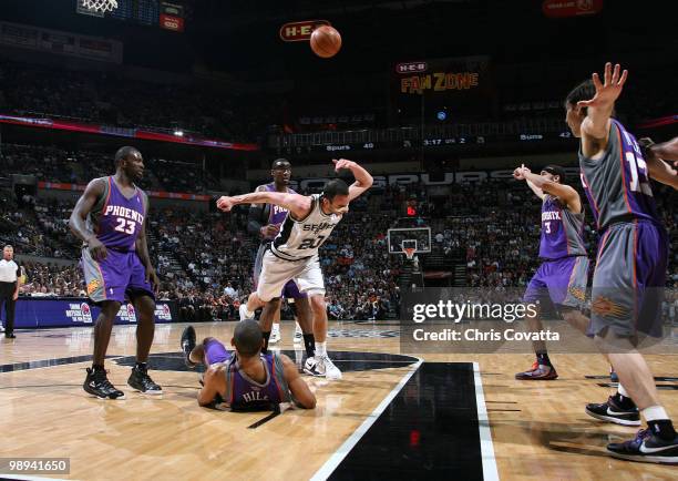 Manu Ginobili of the San Antonio Spurs trips over Grant Hill of the Phoenix Suns in Game Four of the Western Conference Semifinals during the 2010...