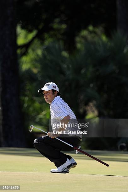 Tim Clark watches his birdie putt at the 12th green during the final round of THE PLAYERS Championship on THE PLAYERS Stadium Course at TPC Sawgrass...