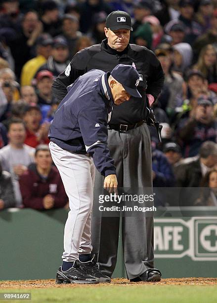 Manager Joe Girardi of the New York Yankees has words with umpire Tim McClelland, who ejected Girardi from the game against the Boston Red Sox at...
