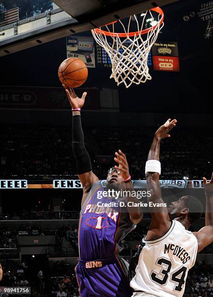 Amar'e Stoudemire of the Phoenix Suns shoots against Antonio McDyess of the San Antonio Spurs in Game Four of the Western Conference Semifinals...