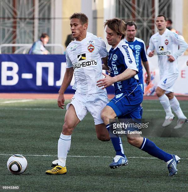 Keisuke Honda of PFC CSKA Moscow battles for the ball with Arunas Klimavichus of FC Sibir, Novosibirsk during the Russian Football League...