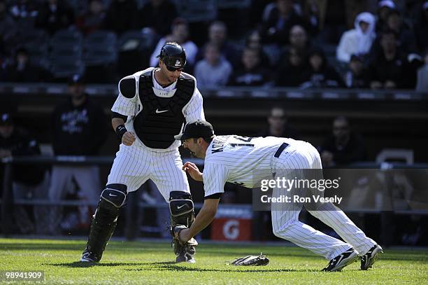 Paul Konerko hangs on to the ball to record the out after colliding with A.J. Pierzynski of the Chicago White Sox on a pop up by Alex Gonzalez the...