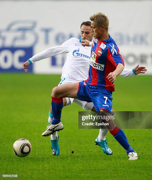 Keisuke Honda of PFC CSKA Moscow battles for the ball with Roman Shirokov of FC Zenit St. Petersburg during the Russian Football League Championship...