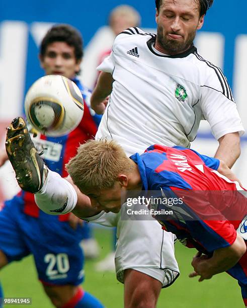 Keisuke Honda of PFC CSKA Moscow battles for the ball with Dorde Jokic of FC Tom Tomsk during the Russian Football League Championship match between...