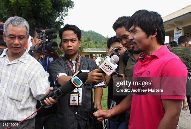 World welterweight boxing champion Manny Pacquiao, who is seeking a seat in the Philippine Congress with his party with the Nacionalista Party, talks...