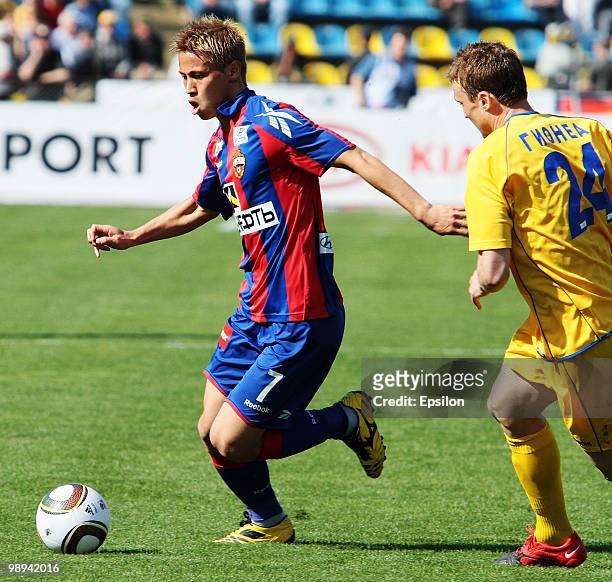 Keisuke Honda of PFC CSKA Moscow battles for the ball with Sorin Gionya of FCRostov Rostov-on-Don during the Russian Football League Championship...