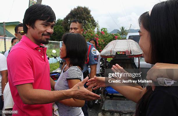 World welterweight boxing champion Manny Pacquiao, who is seeking a seat in the Philippine Congress with his party with the Nacionalista Party,...