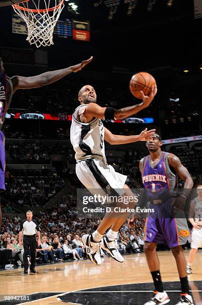 Tony Parker of the San Antonio Spurs shoots a layup against Amar'e Stoudemire of the Phoenix Suns in Game Four of the Western Conference Semifinals...