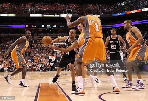 Manu Ginobili of the San Antonio Spurs passes the ball under pressure from the Phoenix Suns during Game Two of the Western Conference Semifinals of...