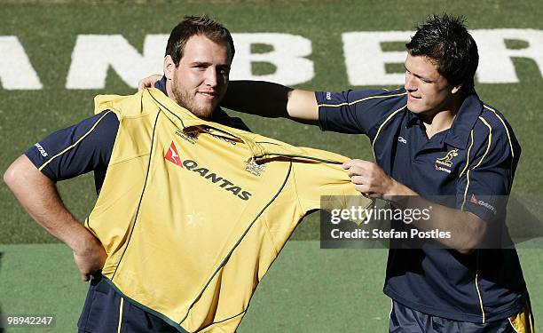 Ben Alexander and Adam Ashley-Cooper pose for photographers during an ARU press conference to announce ticket sales for the Australian Wallabies...