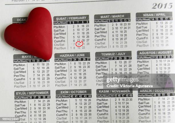 heart lying on the calendar - almanac publication stock pictures, royalty-free photos & images