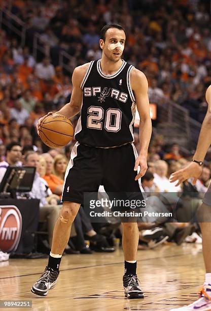 Manu Ginobili of the San Antonio Spurs handles the ball during Game Two of the Western Conference Semifinals of the 2010 NBA Playoffs against the...