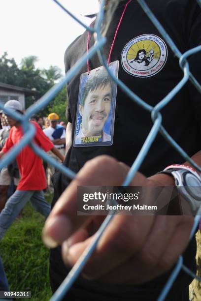 Filipino voters wait to enter a polling center to cast their votes on May 10, 2010 in the southern town of Kiamba, Sarangani Province. The country...