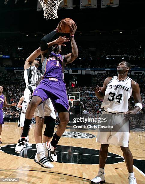 Tim Duncan of the San Antonio Spurs fouls Amar'e Stoudemire of the Phoenix Suns in Game Four of the Western Conference Semifinals during the 2010 NBA...