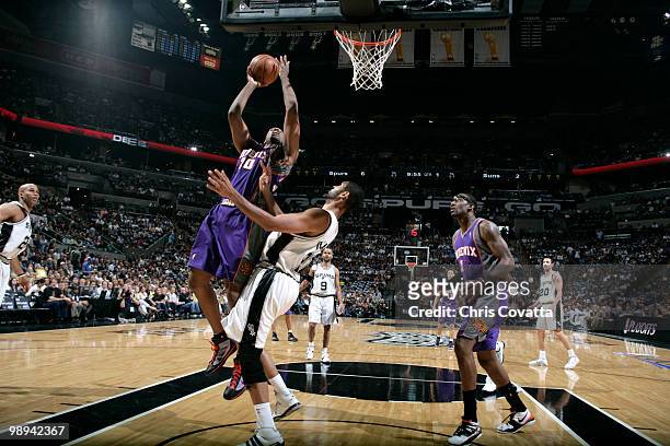 Leandro Barbosa of the Phoenix Suns shoots over Tim Duncan of the San Antonio Spurs in Game Four of the Western Conference Semifinals during the 2010...