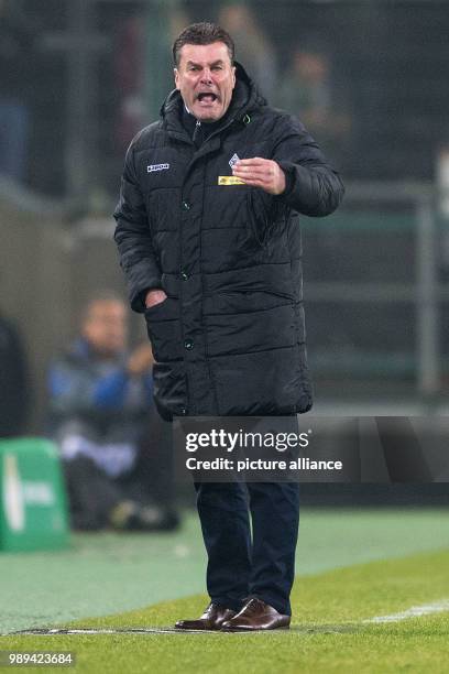 Gladbach's coach Dieter Hecking gestures at the sidelines during the German DFB Cup soccer match between Borussia Moenchengladbach and Bayer...