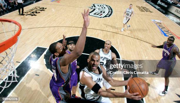 Tony Parker of the San Antonio Spurs attempts to shot around Channing Frye of the Phoenix Suns in Game Four of the Western Conference Semifinals...