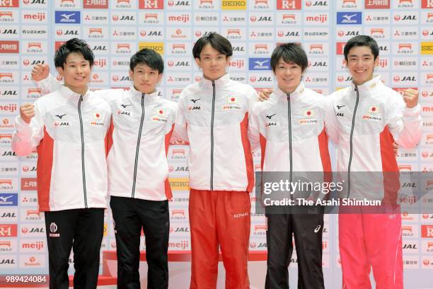 Japan Men's team members for the Wold Championships Kazuma Kaya, Wataru Tanigawa, Yusuke Tanaka, Kohei Uchimura and Kenzo Shirai pose for photographs...