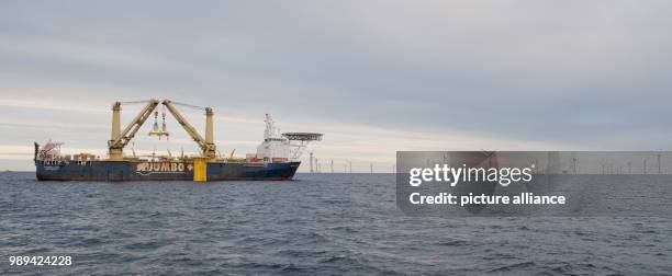 Special ship assembles transition pieces between foundation piles in the Baltic Sea and facilities of the wind farm 'Arkona' off the coast of the...