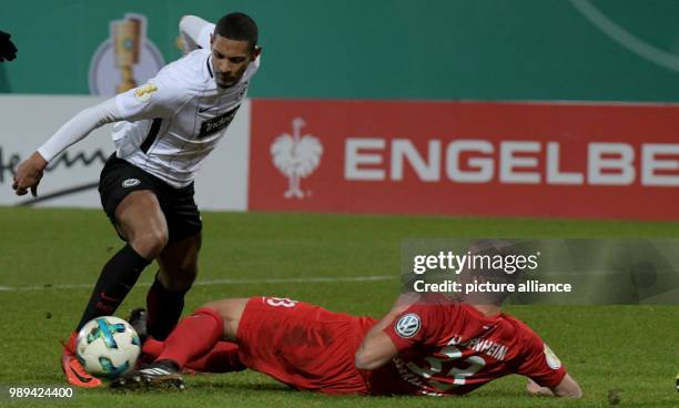 Heidenheim's Timo Beermann and Frankfurt's Sebastien Haller vie for the ball during the German DFB Cup soccer match between 1. FC Heidenheim and...