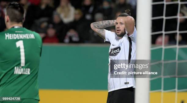 Frankfurt's Marco Russ reacts during the German DFB Cup soccer match between 1. FC Heidenheim and Eintracht Frankfurt in the Voith-Arena in...