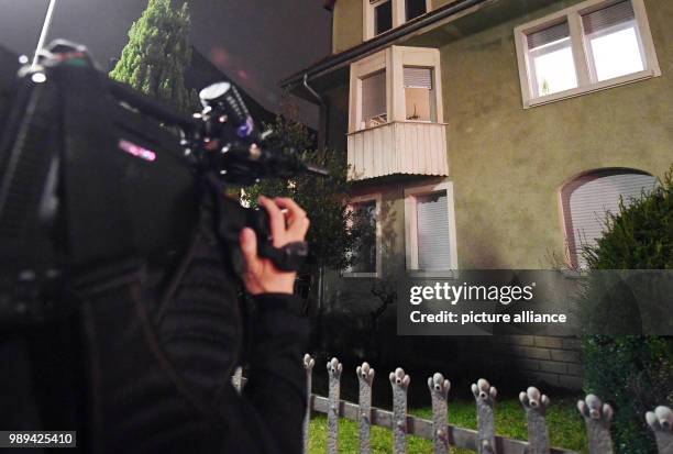 Cameraman films a house in Karlsruhe, Germany, 20 December 2017. The police arrested a man suspected to have planned an attack and to have supported...