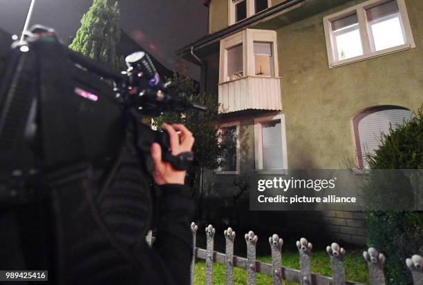 Cameraman films a house in Karlsruhe, Germany, 20 December 2017. The police arrested a man suspected to have planned an attack and to have supported...