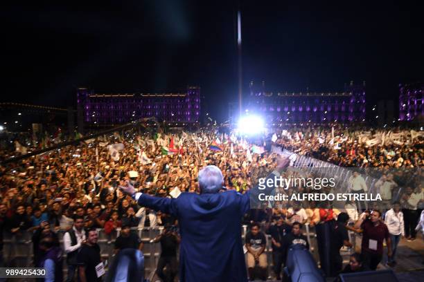 Newly elected Mexico's President Andres Manuel Lopez Obrador , running for "Juntos haremos historia" party, cheers his supporters at the Zocalo...