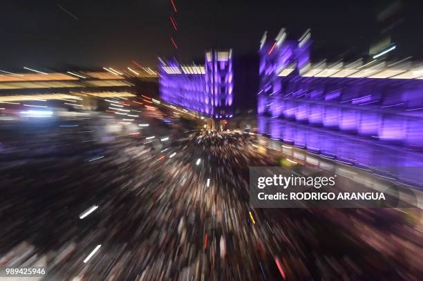 Supporters of the presidential candidate for the "Juntos haremos historia" coalition, Andres Manuel Lopez Obrador, celebrate at the Zocalo square in...