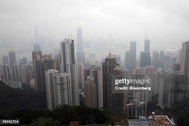 High rise buildings blanketed in haze tower above Victoria Harbor in Hong Kong, China, on Friday, May 7, 2010. Hong Kong's air pollution was the...