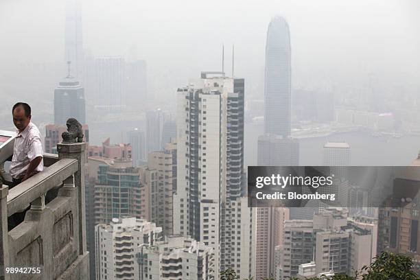 High rise buildings blanketed in haze tower above Victoria Harbor in Hong Kong, China, on Friday, May 7, 2010. Hong Kong's air pollution was the...